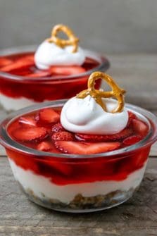 two bowls filled with old fashioned strawberry pretzel salad.