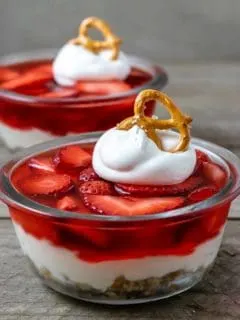 two bowls filled with old fashioned strawberry pretzel salad.