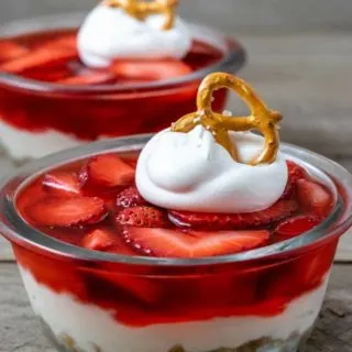 two bowls filled with old fashioned strawberry pretzel salad.