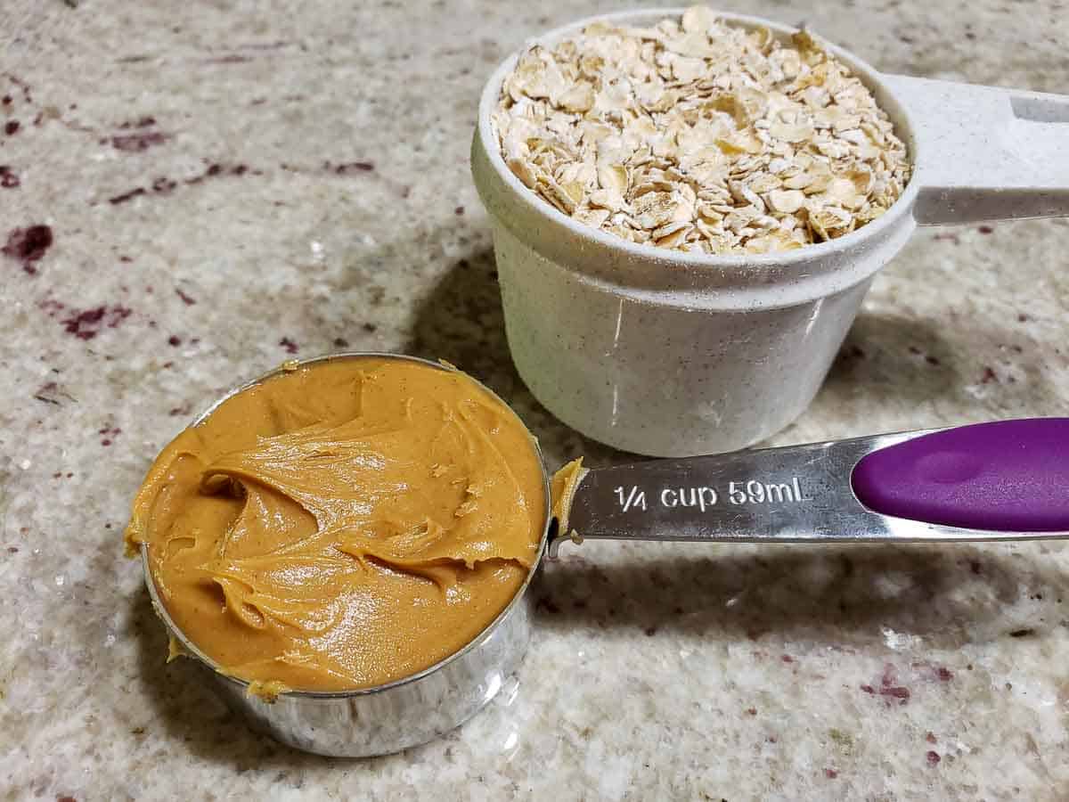 peanut butter and oats pre-measured in measuring cups.