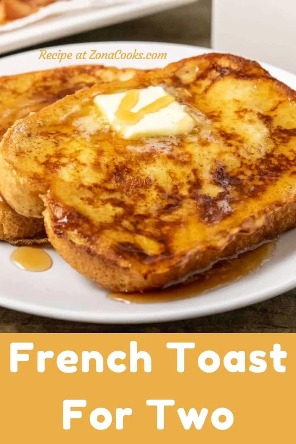 two thick slices of texas toast french toast topped with butter and syrup and text reading french toast for two recipe at zonacooks.com.