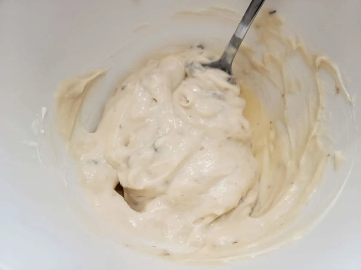 cream of chicken soup and sour cream mixed in a bowl.