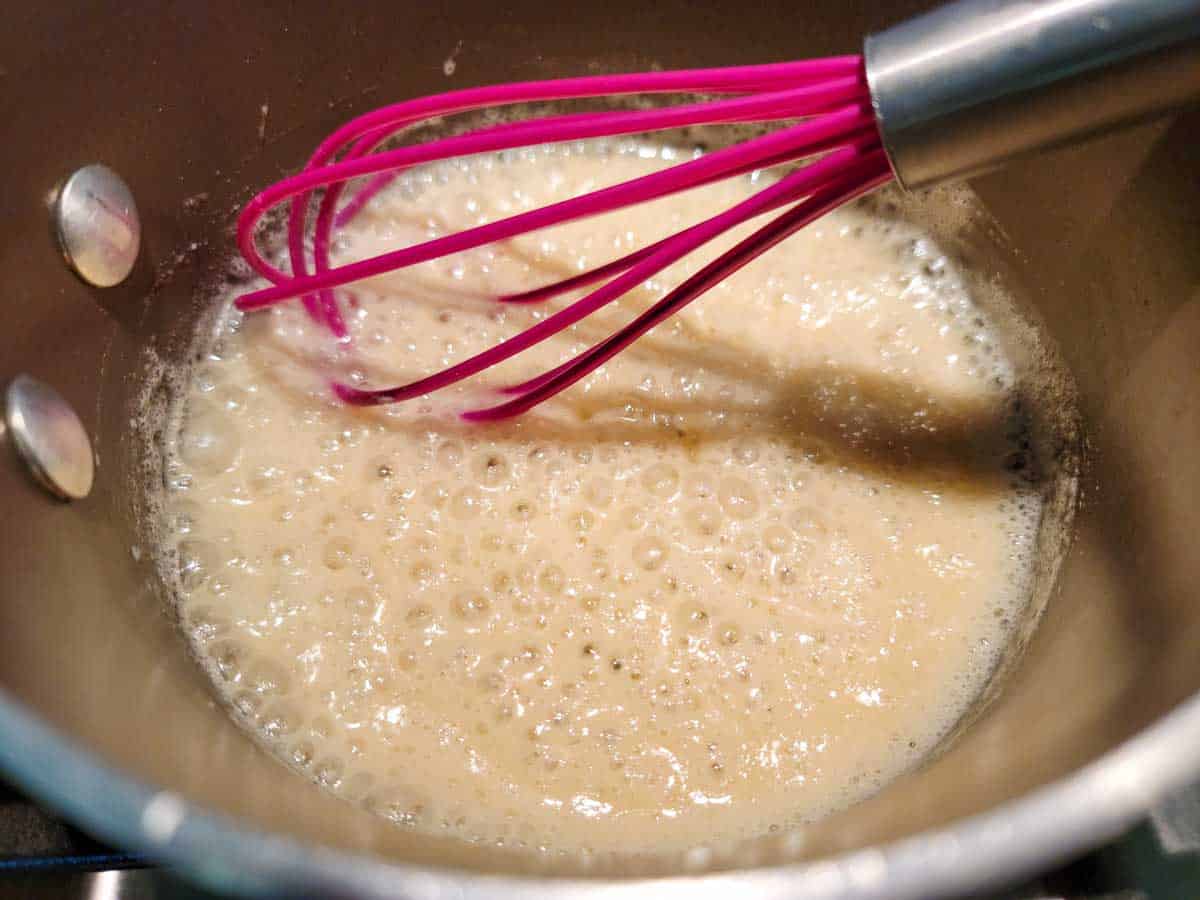 butter and flour roux whisked in a sauce pan.