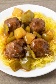 a plate filled with Spaghetti Squash with Hawaiian Meatballs, pineapple, and green peppers.