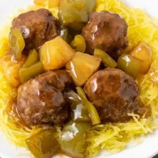 a plate filled with Spaghetti Squash with Hawaiian Meatballs, pineapple, and green peppers.