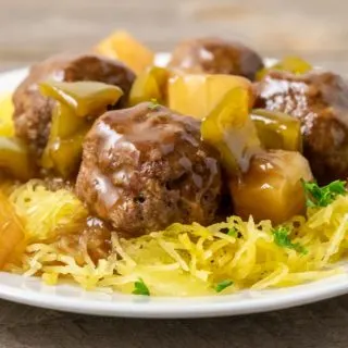 a plate filled with Spaghetti Squash and Hawaiian Meatballs, pineapple, and green peppers.