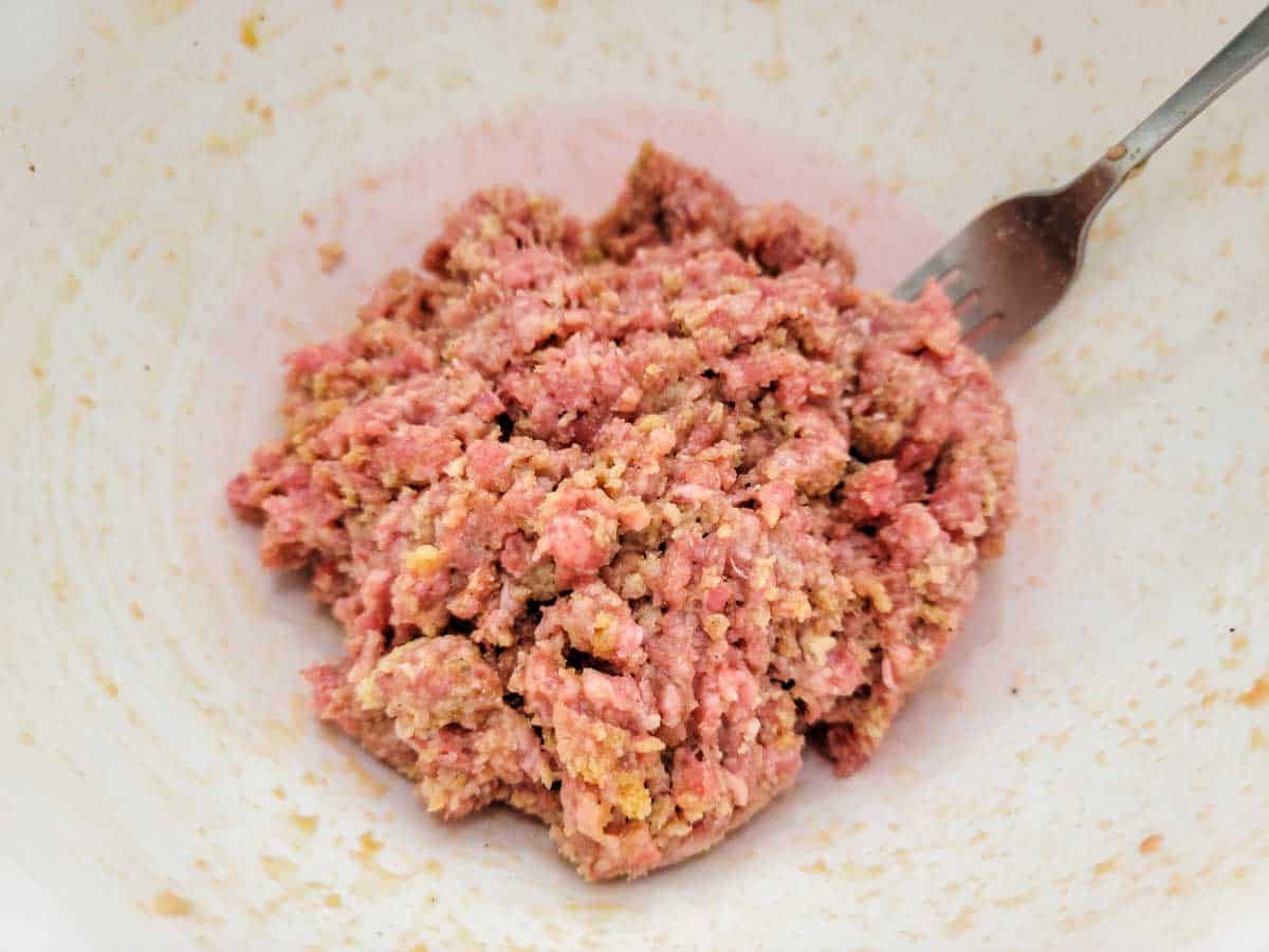 ground beef meatball mixture in a bowl.