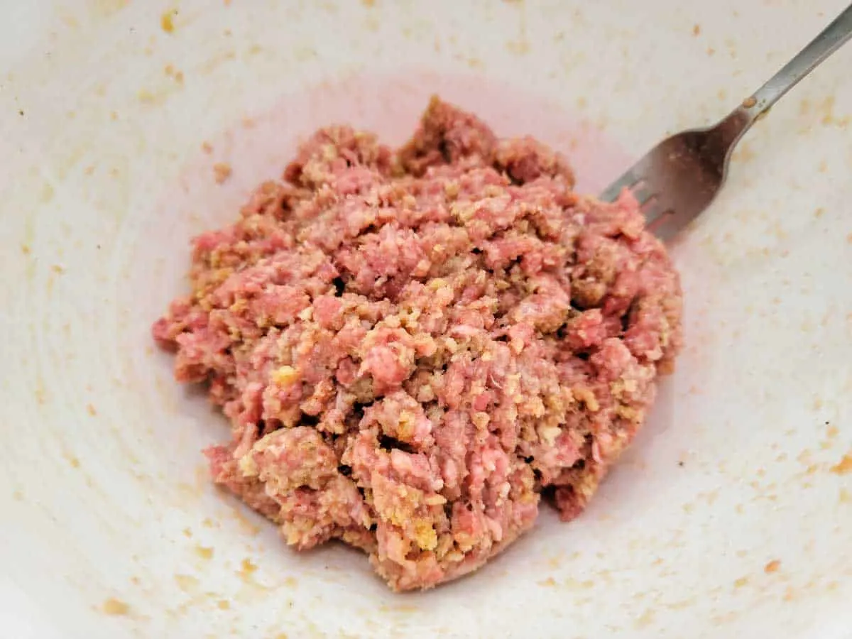 ground beef meatball mixture in a bowl.