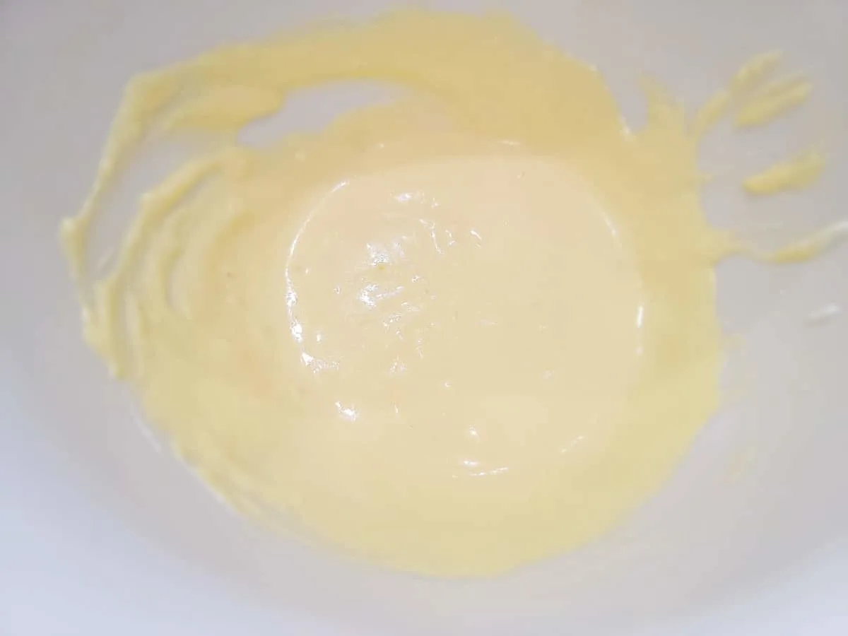 mutter, sour cream, and egg whisked in a bowl.