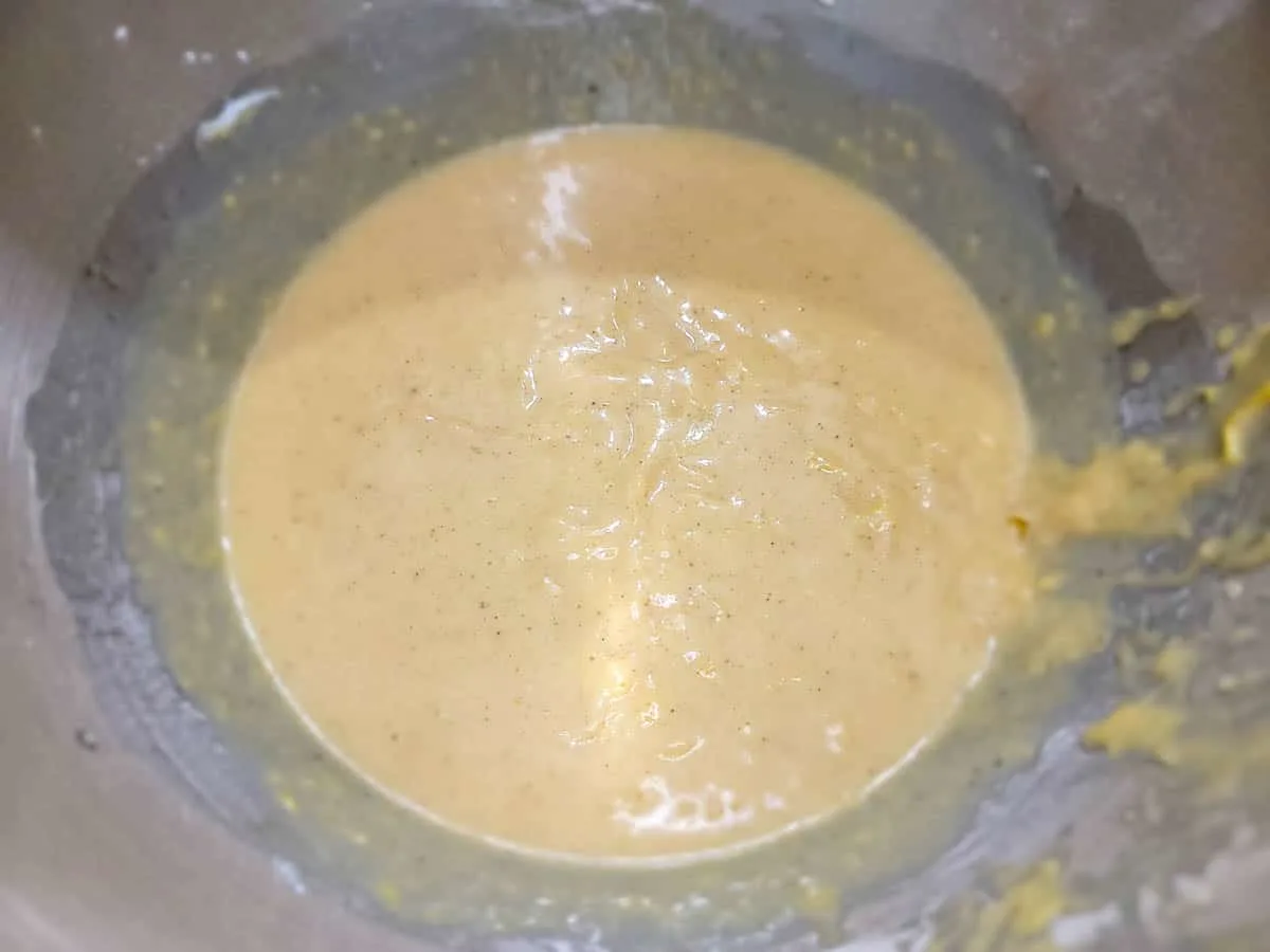 pumpkin spice cake batter mixed in a bowl.