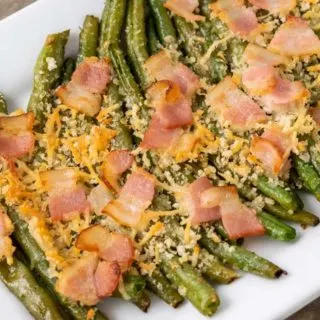 Roasted Green Beans with Bacon and Parmesan cheese on a plate.