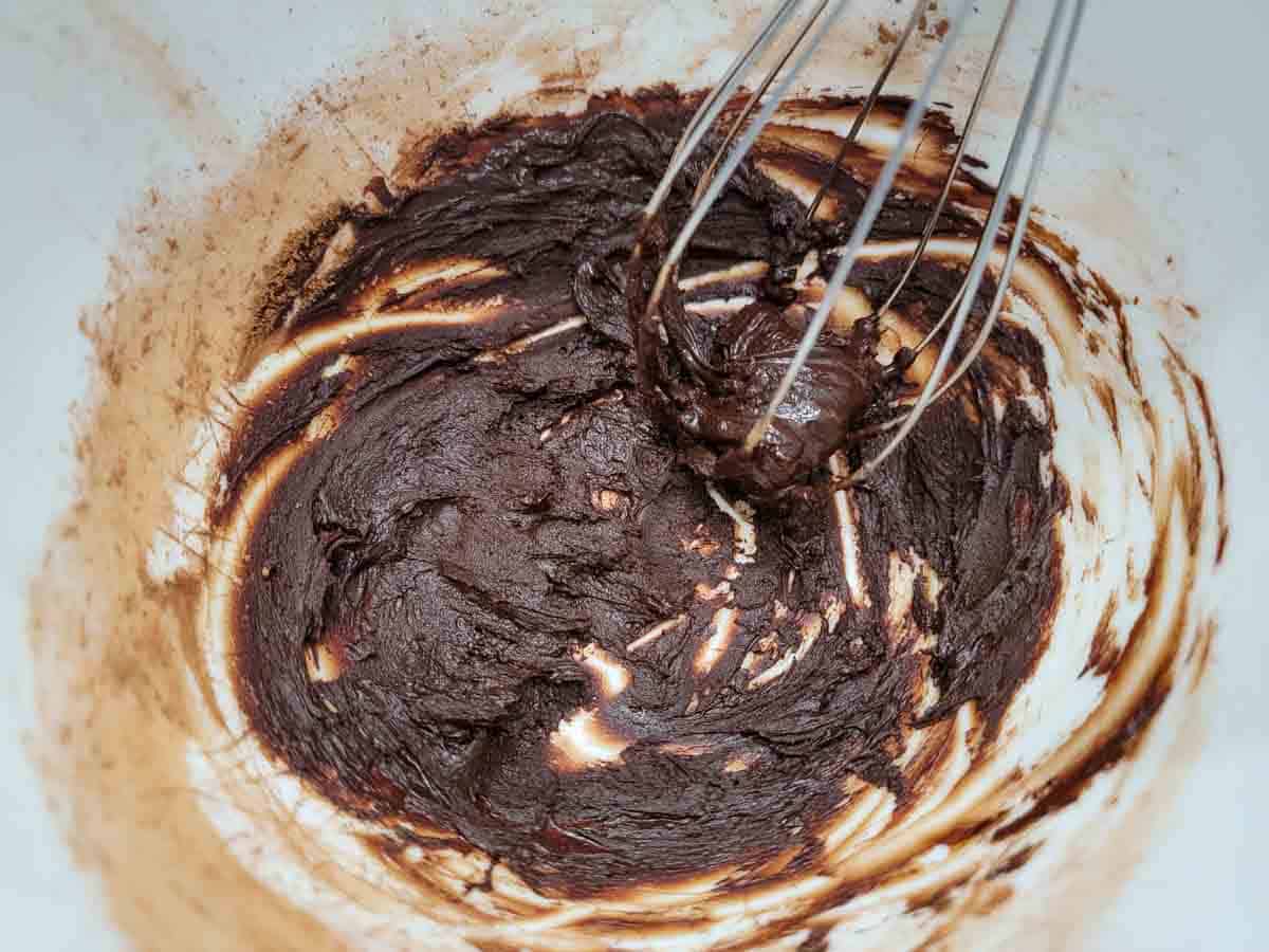 butter and cocoa whisked in a bowl.