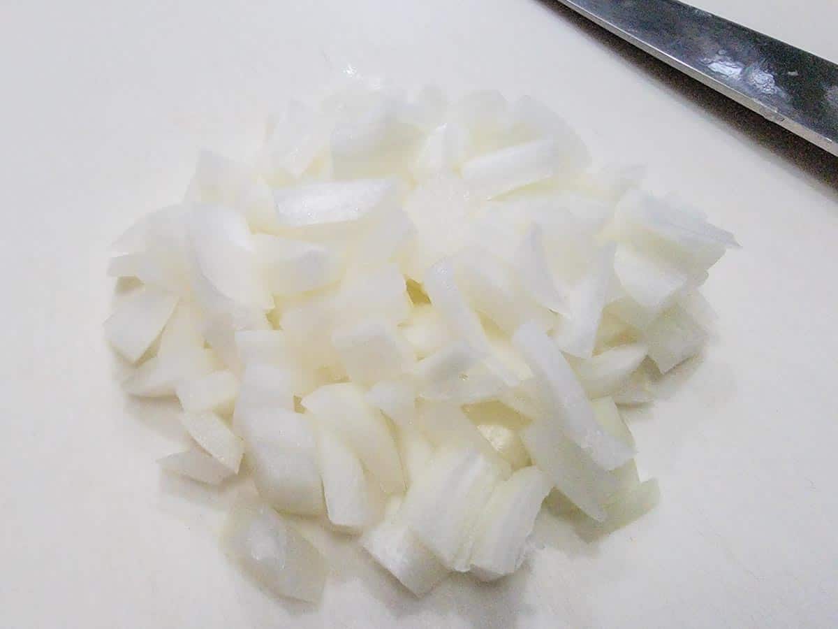 diced onions on a cutting board.