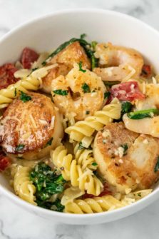 Shrimp and Scallop Pasta in creamy garlic Tuscan sauce.