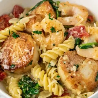 Shrimp and Scallop Pasta in creamy garlic Tuscan sauce.