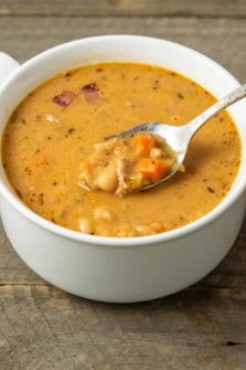 a bowl filled with White Bean Bacon Soup.