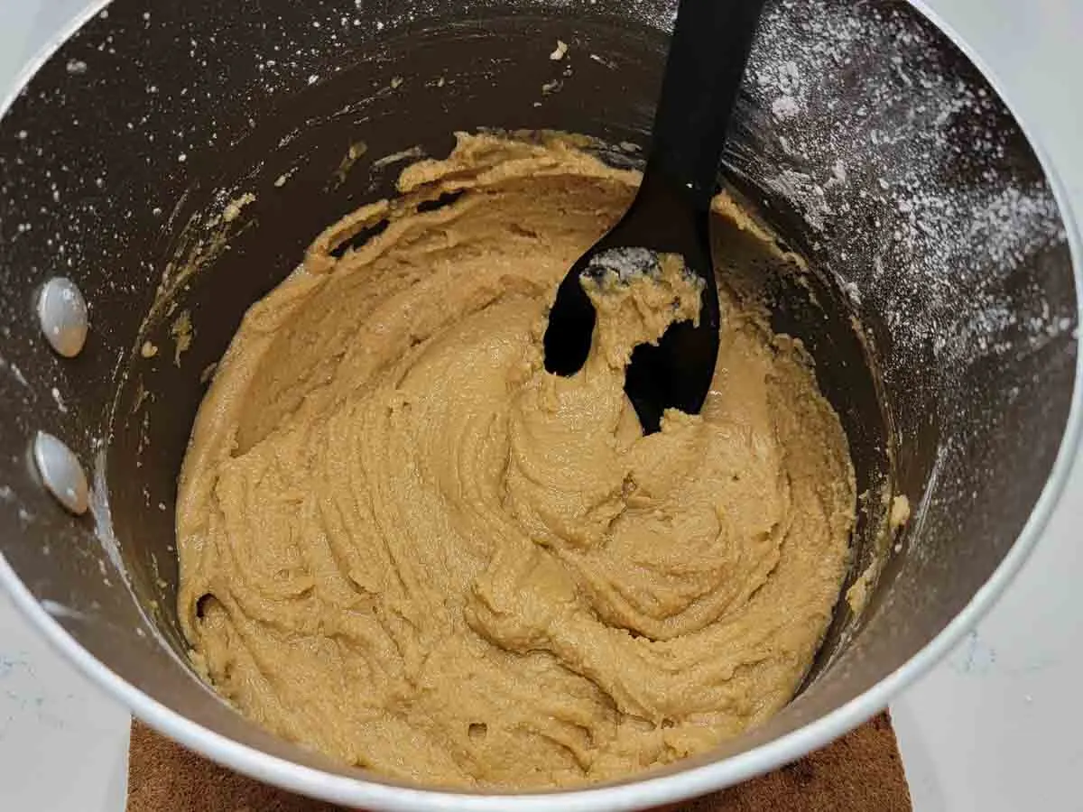 peanut butter fudge batter mixed in a pan.