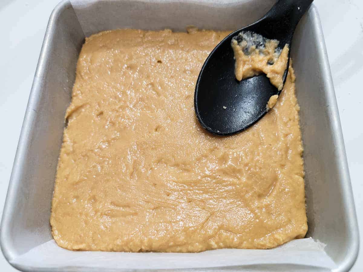 old fashioned peanut butter fudge pressed into a cake pan.