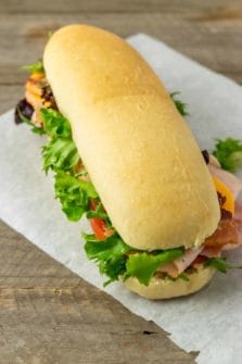 a homemade hoagie roll filled with sub sandwich ingredients.