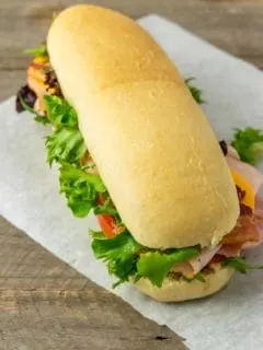 a homemade hoagie roll filled with sub sandwich ingredients.