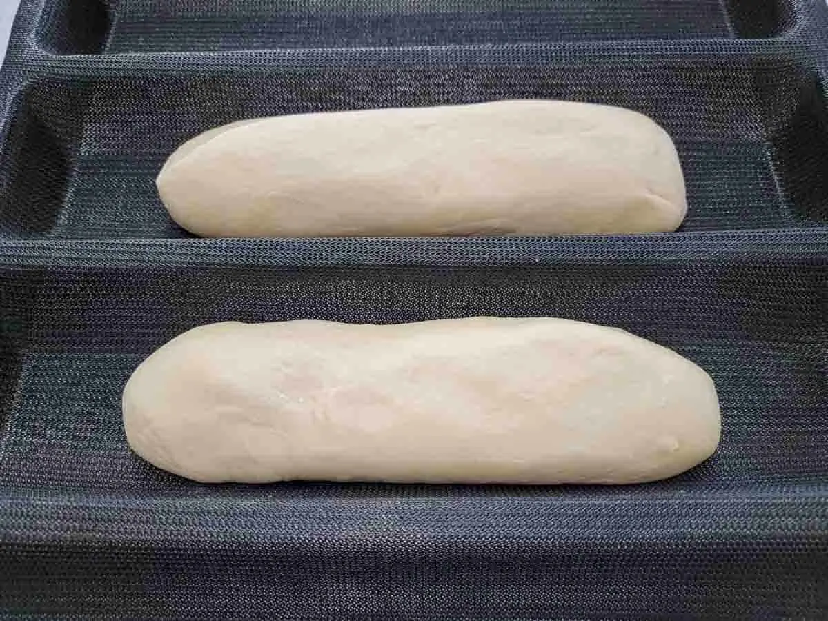 soft dough rolled into 6 inch log shapes and placed in a loaf mold.