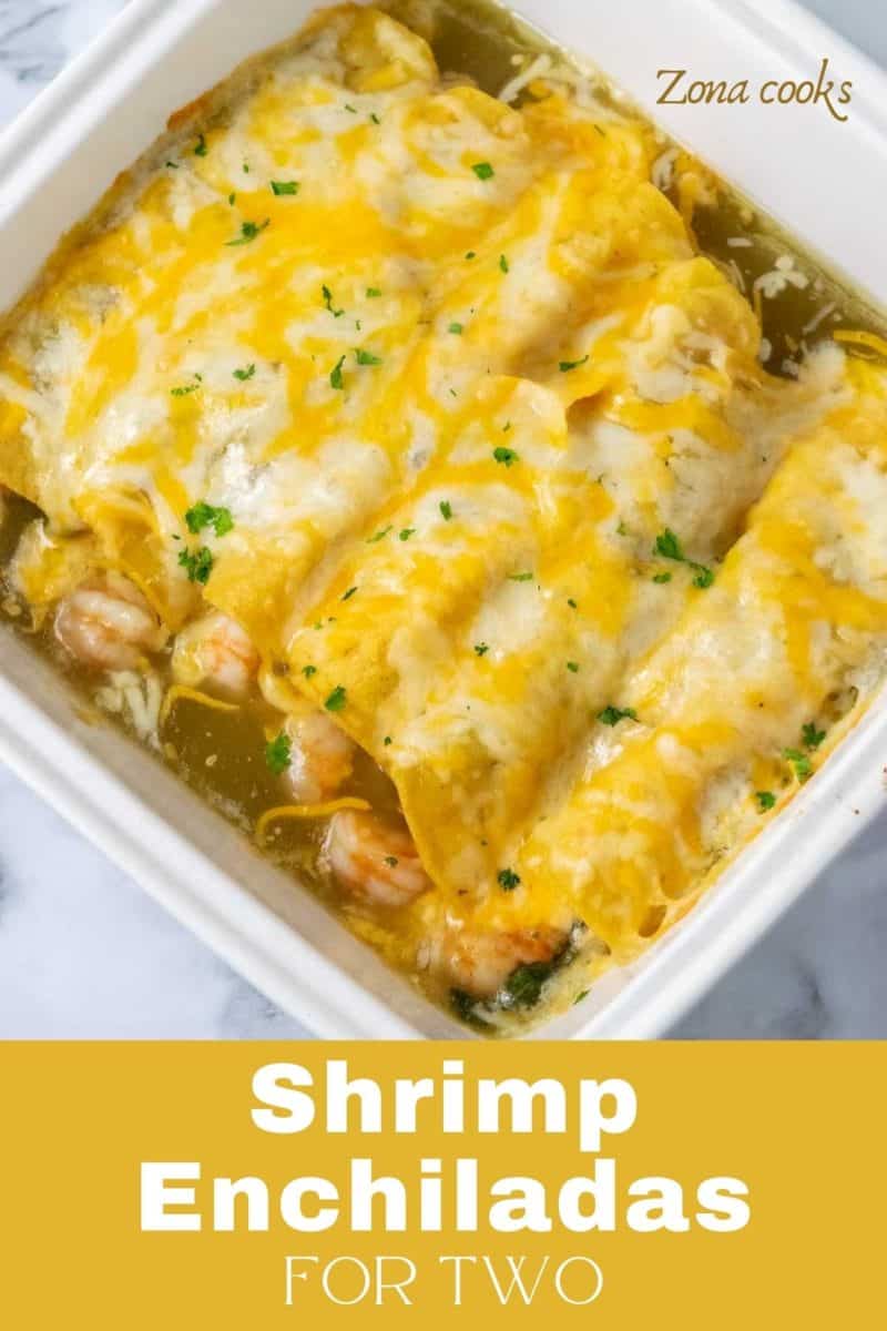 a casserole dish filled with 6 cheesy shrimp enchiladas.