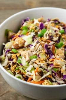 a close view of a bowl filled with Asian Chicken Ramen Salad.