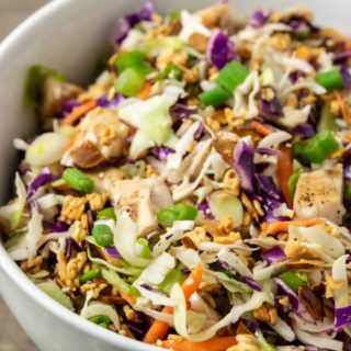 a close view of a bowl filled with Asian Chicken Ramen Salad.