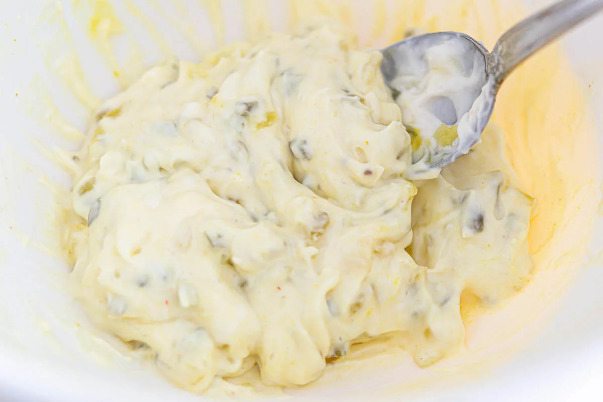creamy mayo, pickle relish, and mustard dressing in a bowl.