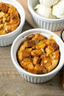 Pineapple Banana Bread Pudding topped with caramel sauce and a side of ice cream.