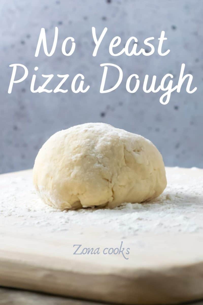 a ball of pizza dough on a floured surface.