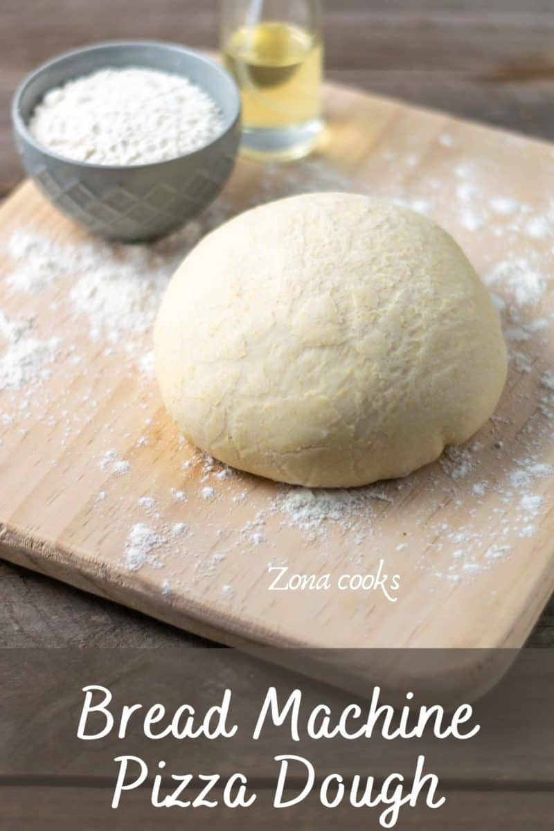 bread machine pizza dough on a floured cutting board.