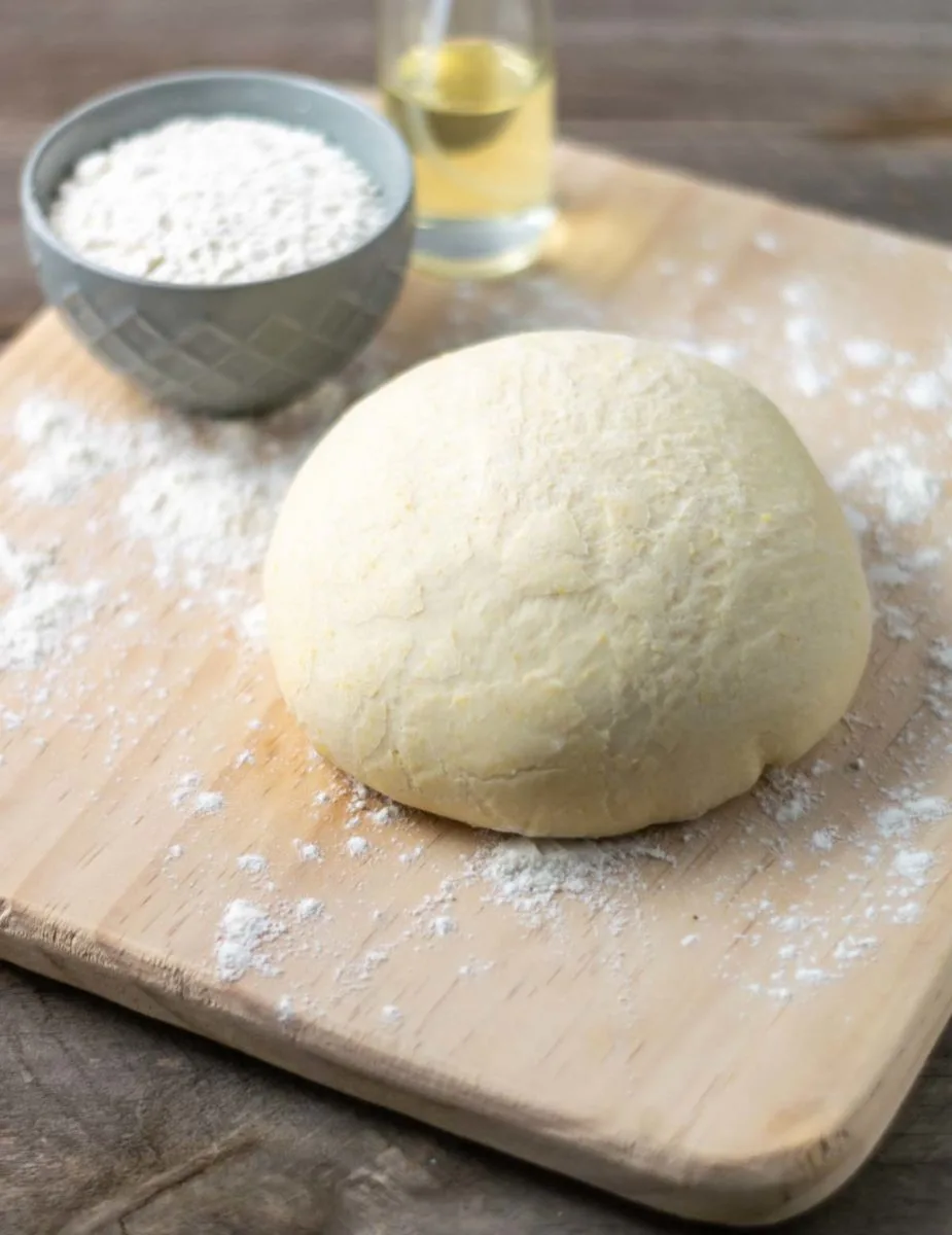 a ball of pizza dough made in a bread machine.