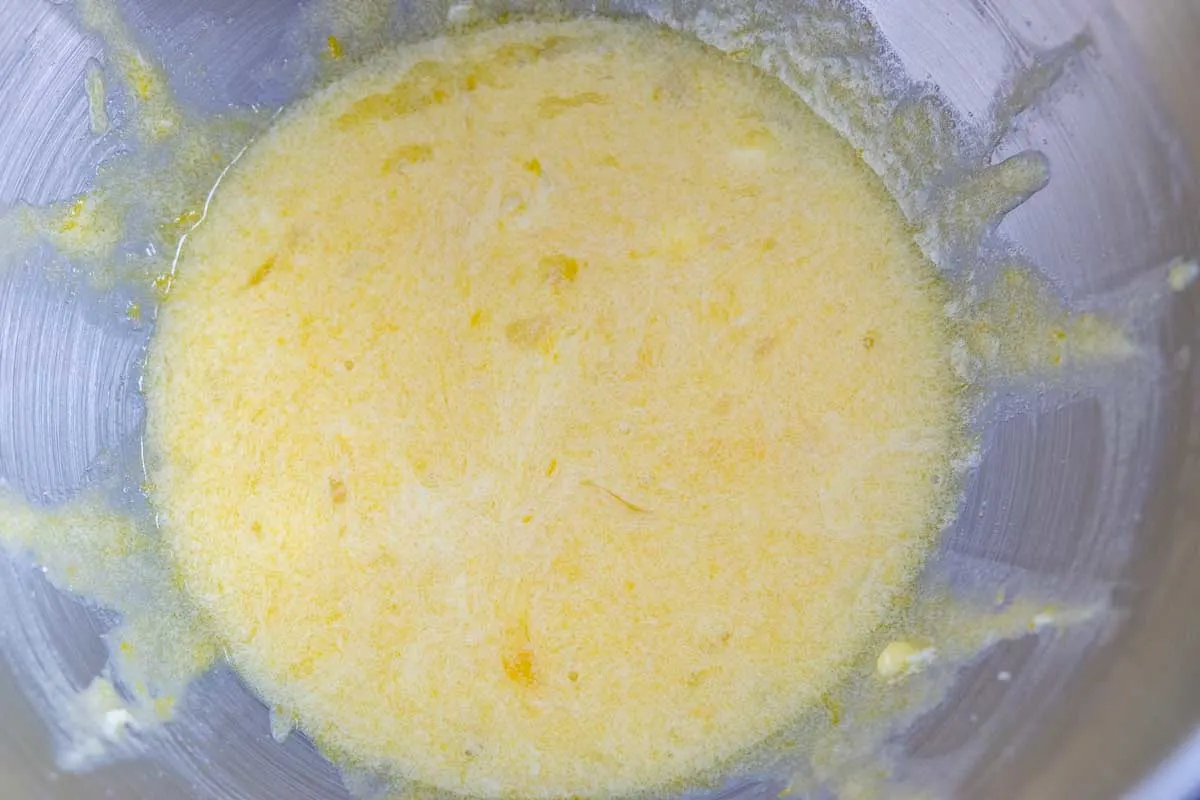 egg and vanilla whisked into wet ingredients in a bowl.