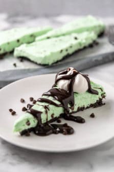 a slice of Mint Oreo Cheesecake on a plate.