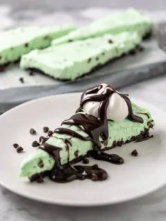 a slice of Mint Oreo Cheesecake on a plate.