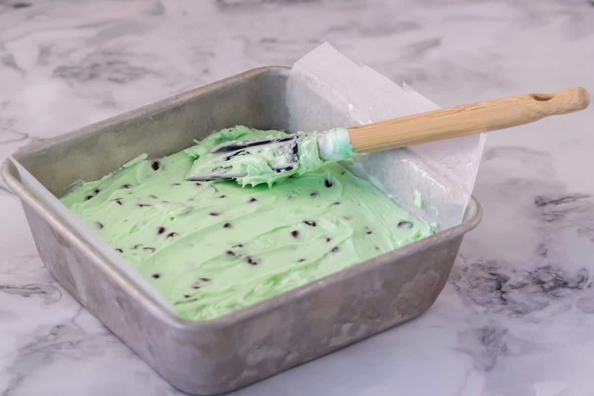 No Bake Mint Chocolate Chip Cheesecake in a cake pan.