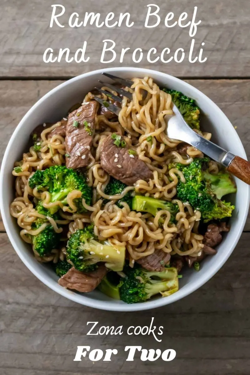 a bowl filled with chinese noodles, beef, and broccoli in a brown sauce.