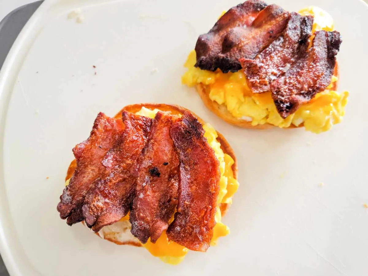 bacon added to a breakfast croissant sandwich.