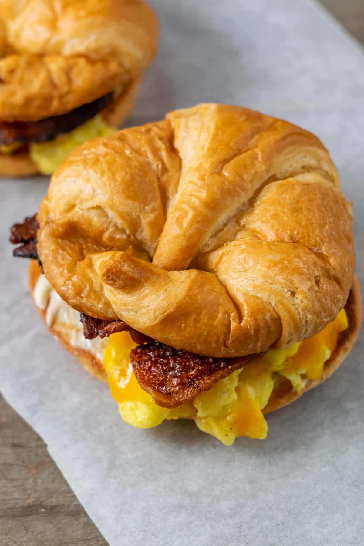 Croissant On Baking Sheet In Stainless Steel Oven Stock Photo