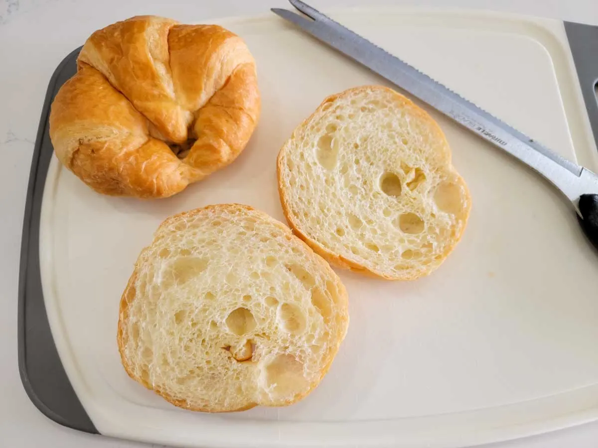a croissant sliced in half.