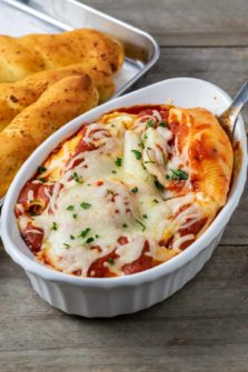 Cheese Stuffed Shells without Ricotta and a side of bread sticks.