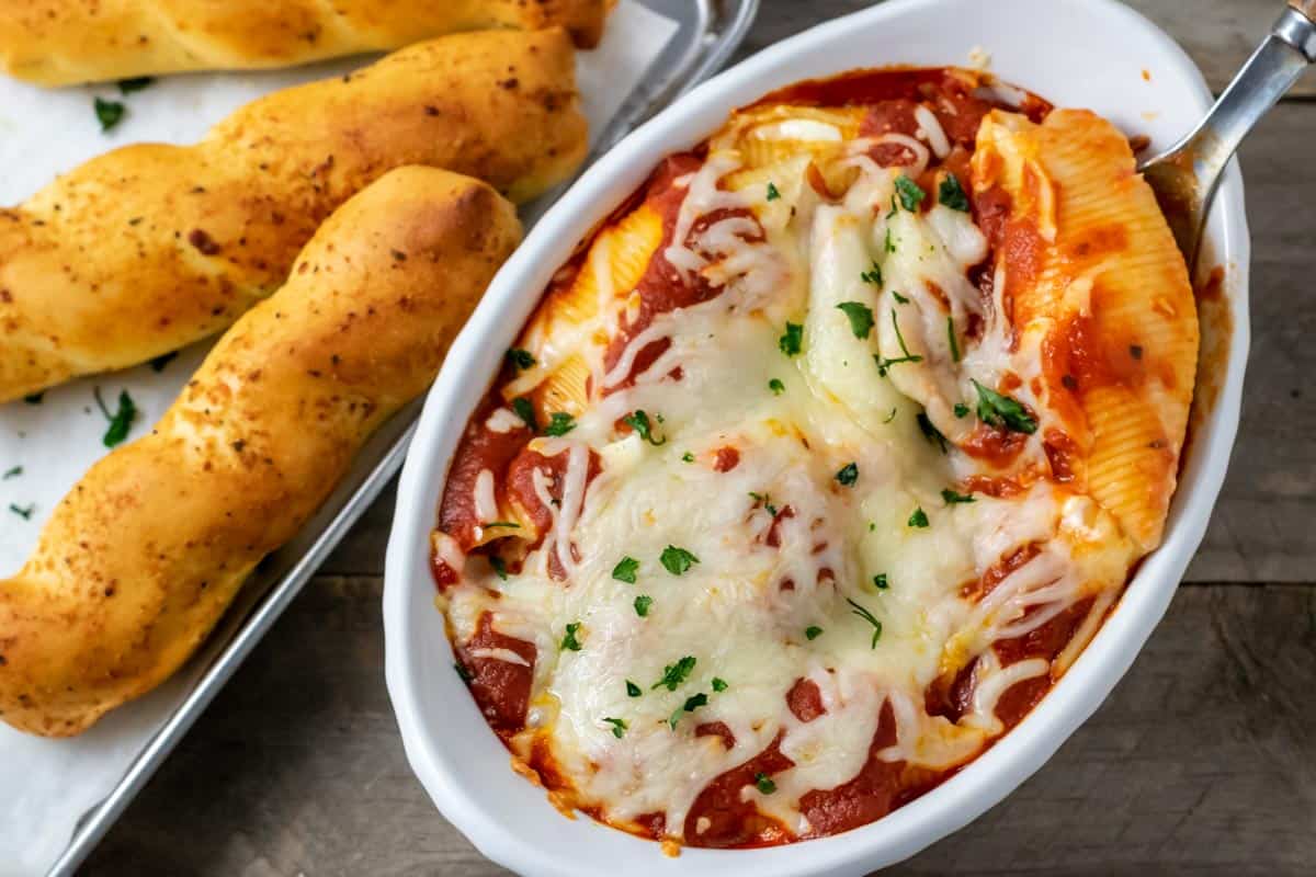 Cream Cheese Stuffed Shells and a side of bread sticks.