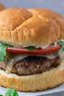 a turkey burger on parchment paper.