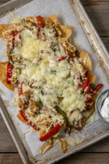 Chicken and Bell Peppers Chips and Cheese on a baking sheet.