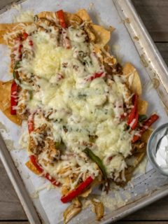 Chicken and Bell Peppers Chips and Cheese on a baking sheet.