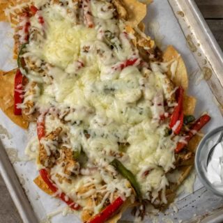 Chicken and Bell Peppers Chips and Cheese on a baking sheet.