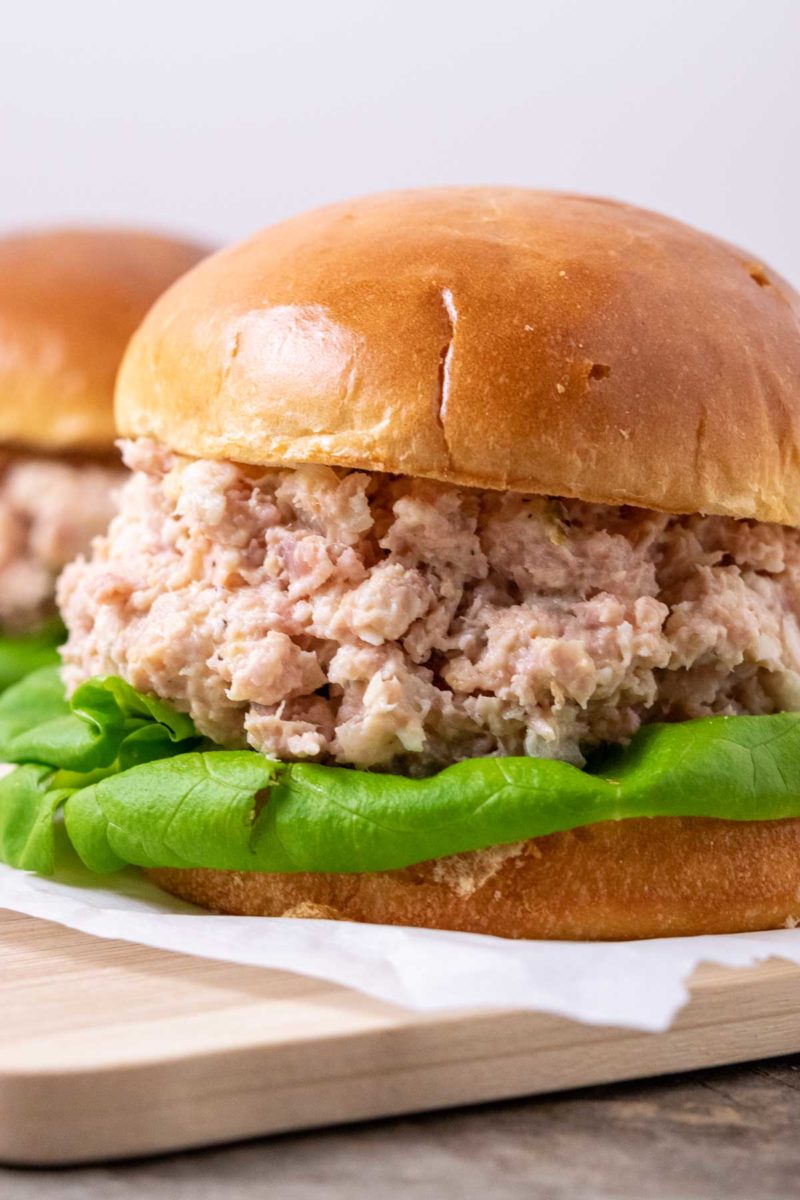 chopped ham salad on a sandwich roll.