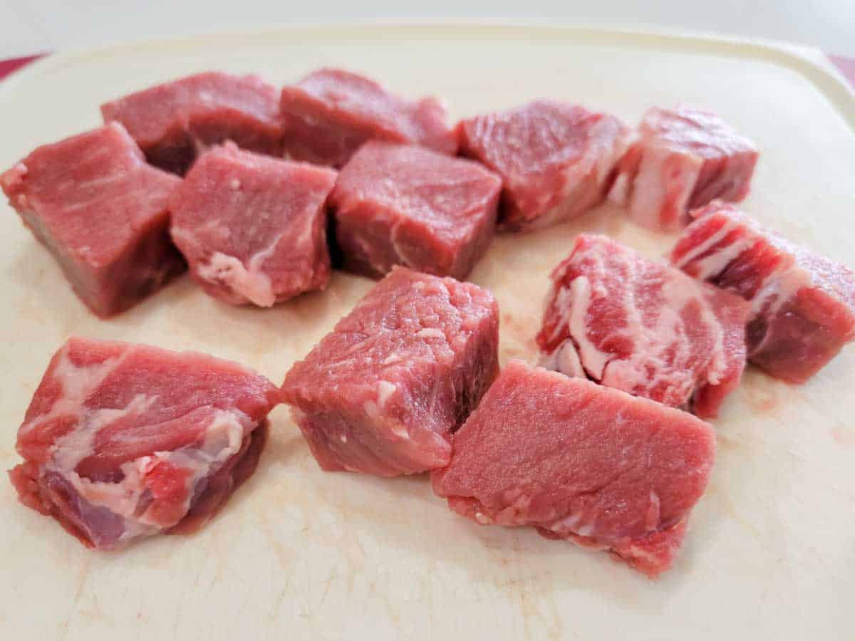 ribeye steak cut into cubes.