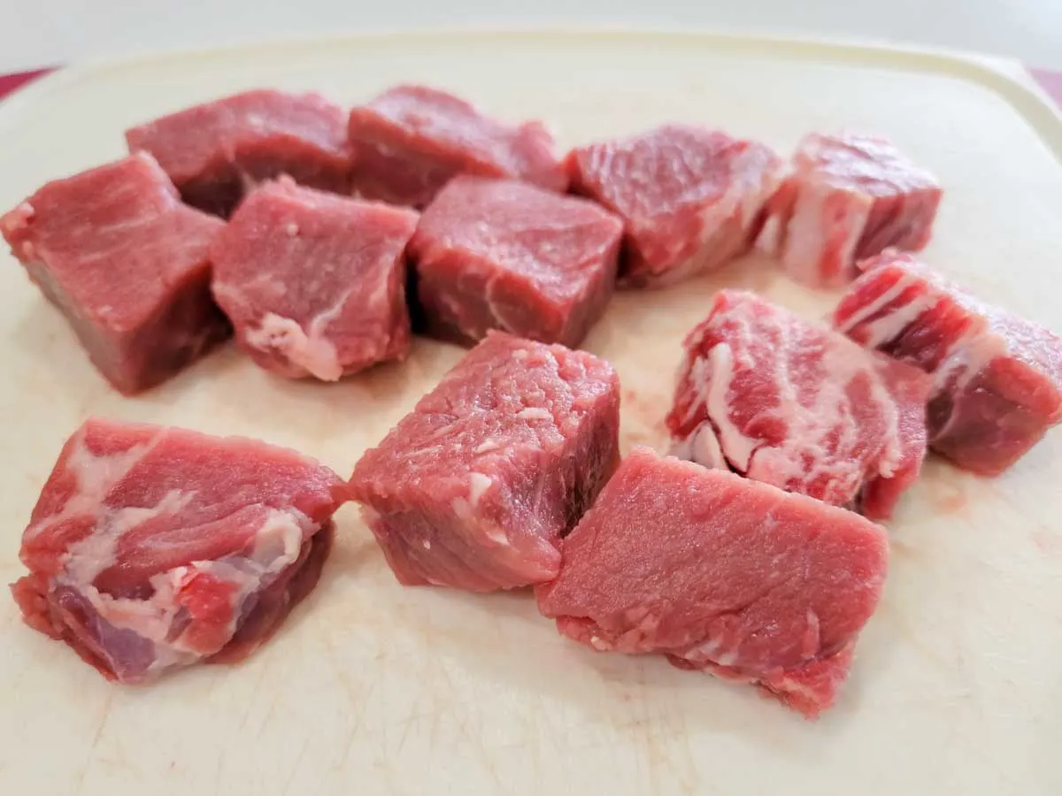 ribeye steak cut into cubes.